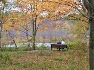 A couple enjoys the fall foliage at Heins Farm