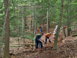 Participants in the course help build a single track